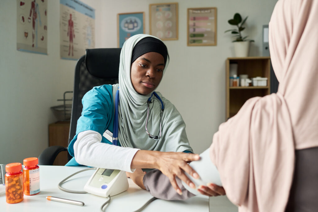 examining muslim patient in medical office setting